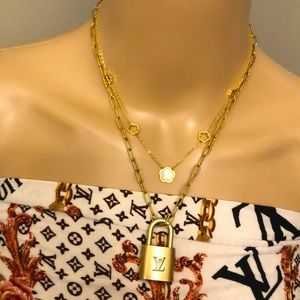 Repurposed Aunthentic Louis Vuitton padlock with New Stainless steel necklace.